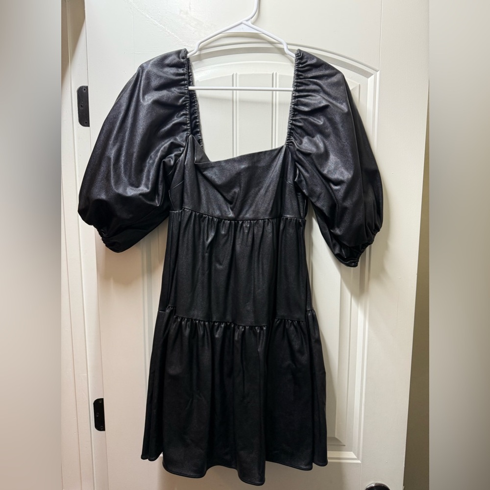Black faux leather babydoll dress
size small
worn once